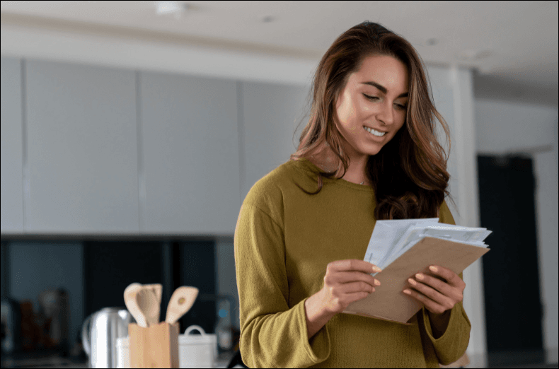 woman looking at mail